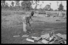 0058_Black_American boy chopping wood, Tangipahoa Parish , Louisiana
