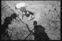 0346_Transient worker clearing land, Prince George's County, Maryland]