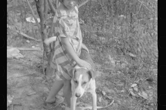 0427_Child with dog , probably of family of  ten, Brown County, Indiana