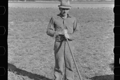 0478_Farmer with traditional 4 tine cultivator, Kansas