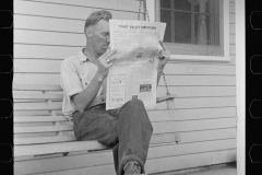 0546_ Newspaper reading , Tygart Valley Homestead .