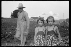 0558_Farmer and his two daughters, Tygart Homesteads