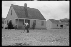 0561_Sharpening a scythe, Tygart Valley Homesteads