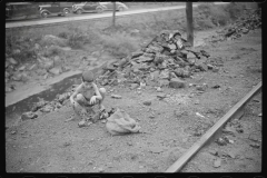 0709_Miner's son with bag of coal,