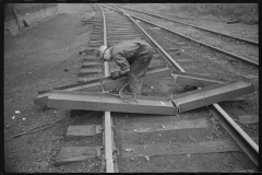 0744_Track worker cutting a steel section with a welding torch , unknown location