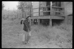 0753_Mexican  miner carrying water