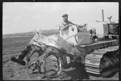 0787_  Powered rear cultivator on tracked vehicle.