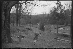 0852_Children playing on rudimentary rope swing,