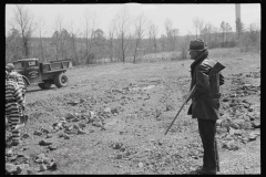 1126_Convicts grading the road , Jefferson County , Alabama .  Guard with gun .