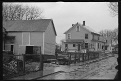 1168_Newer houses on street, possible flood damage