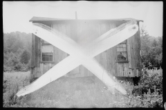 1242_ruined shack , spoiled negative ,    unknown location .