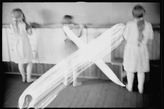 1245_Three unknown  young girls , doing laundry , unknown location