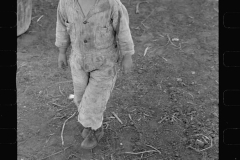 01572_Young child in stripey suit, unknown and location unknown