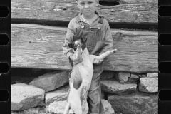 01601_unknown child with pet dog , unknown location ,