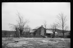 01603_Modest settler fenced with stock , homestead , unknown location