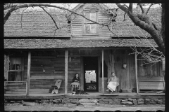 1609_Women sitting on the porch , traditional   homestead