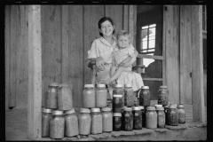 1633_ Unknown Wife with child on porch with Kilner jars of preserves