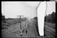 1654_Workers walking alongside railroad track