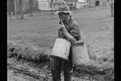 1827_Farmer with cans possibly for milk or animal feed ,unknown location