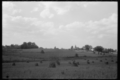 1874_Pride of harvest, hay stooks  farmer with son , unknown location.