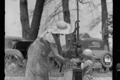 1989_Mother at pump (water) with child drinking .