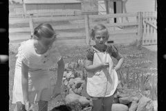 1990_Possibly sisters with kid goat ,