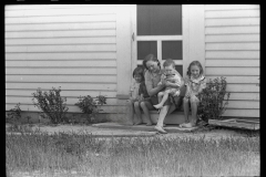 2026_Mother and young family sit on the step ,Wabash Farms ,