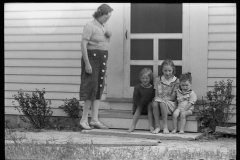 2027_Mother with children sitting on the step ,Wabash  Farms