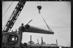 2260_Unloading a sewer pipe by crane, Greenbelt construction, Maryland