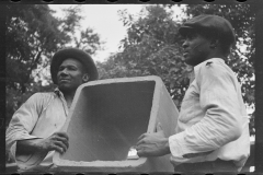 2261_Workmen unloading tile pipe, Greenbelt, Maryland