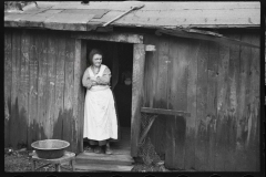 2440_Rehabilitation client's wife in he doorway of her home , Jackson County, Ohio