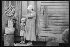 2445_Rehabilitation client's wife and child  in the doorway of their home , Jackson County, Ohio