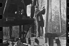 2989_Loading device moving railroad cars full of timber at camp near Effie, Minnesota