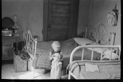 3009_Child of Edwin Gorder  in farmhouse bedroom,