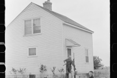 3289_ Part time farmer with his son , Wabash Farms , Indiana.