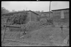 3571_Miner leaving his home , Bertha Hill, West Virginia