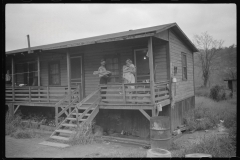 3574_Coal miner, his wife and baby living in a  company shanty , Scotts Run, West Virginia