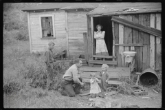 3594_Coal miner and some of his family in back of their home. Bertha Hill, West Virginia