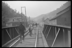 3699_Miners going home after work, children going to school