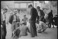 3732_Miners playing cards outside company store, Chaplin