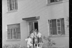 3797_Mother at the door with children , Greenbelt, Maryland