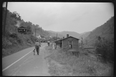 3812_Carrying water to abandoned mining community,