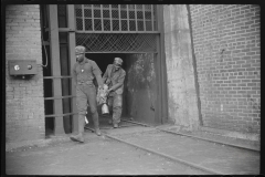 3844_Miners handing  in their  lamps . Caples, West Virginia