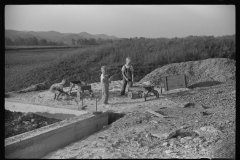 3895_ children playing in pile of  sand, Tygart Valley, West Virginia