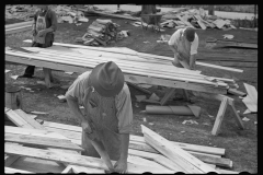 3939_ Carpenter shaping  gable of prefabricated house, Roanoke Farms, North Carolina