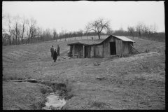 2460_Resettlement Administration representative outside client's  house/shack , Jackson County