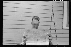 4203_Tygart Valley homesteader reading Newspaper