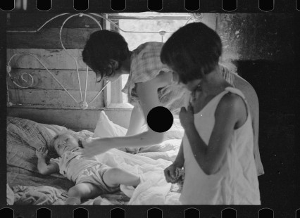 0008_Wife of sharecropper with sick child