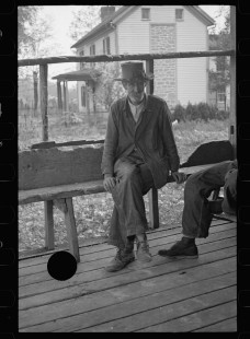 0165_Man on bench outside Post Office