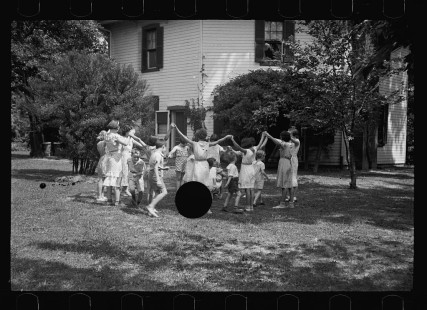 0307_Children in middle-class American garden